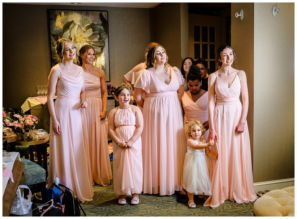 bridesmaids looking at bride