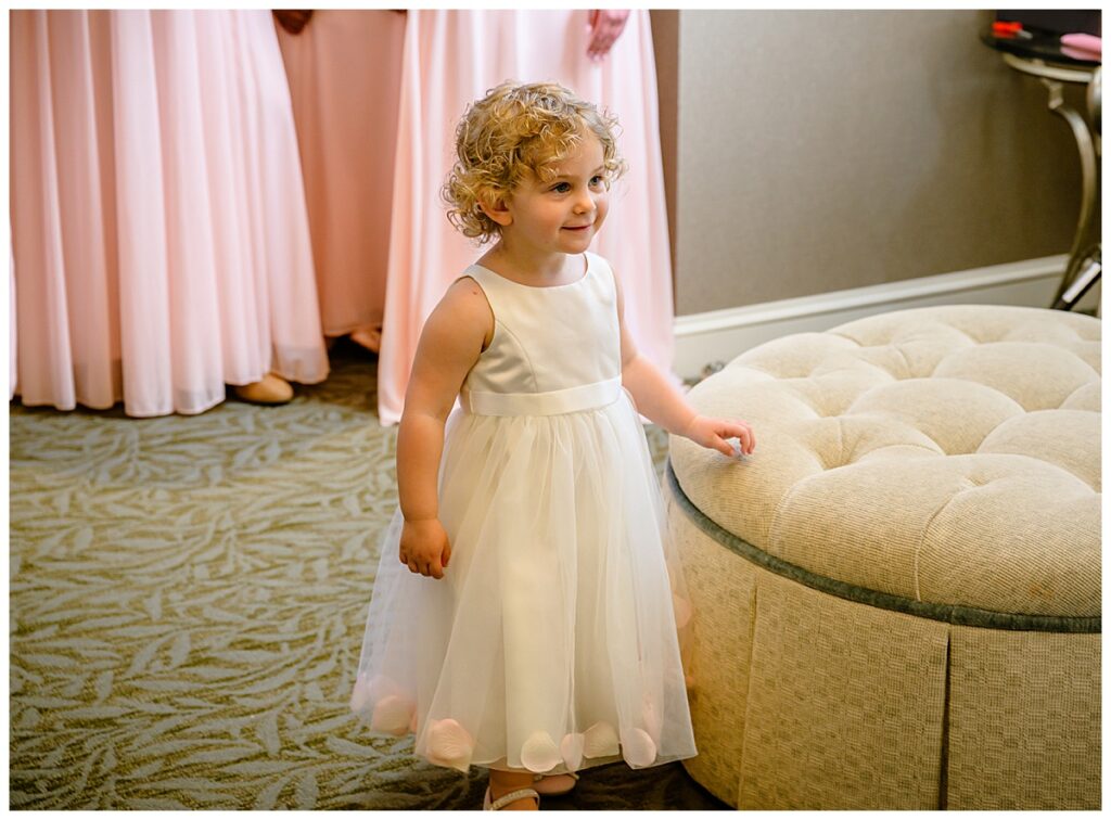 flower girl looking at bride