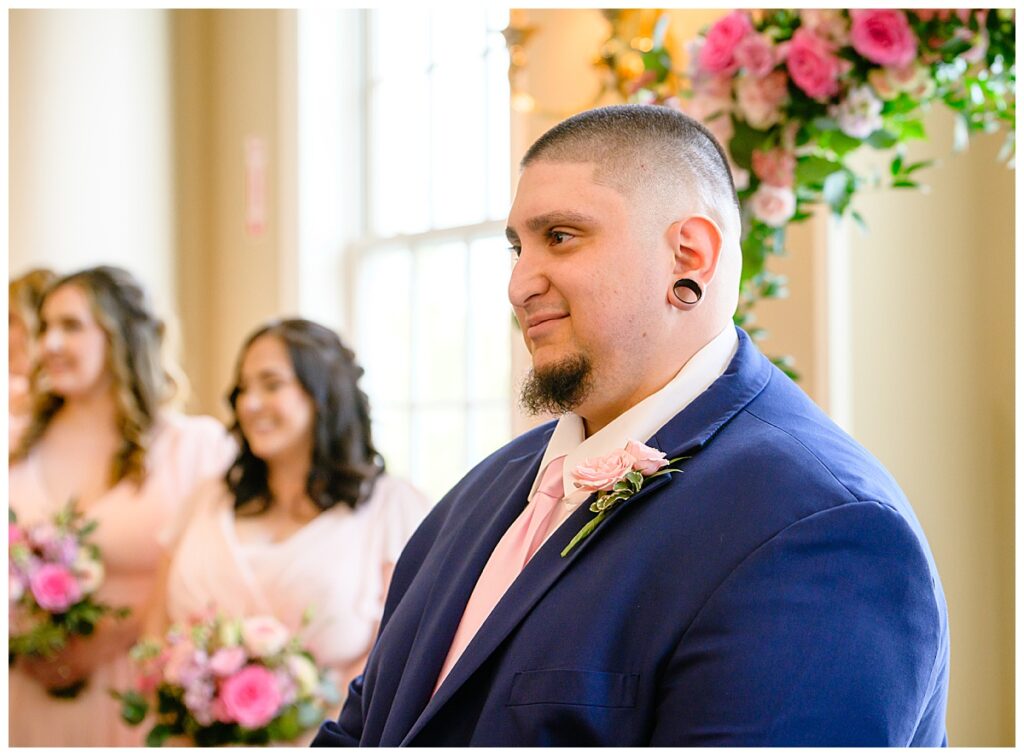 groom looking at bride