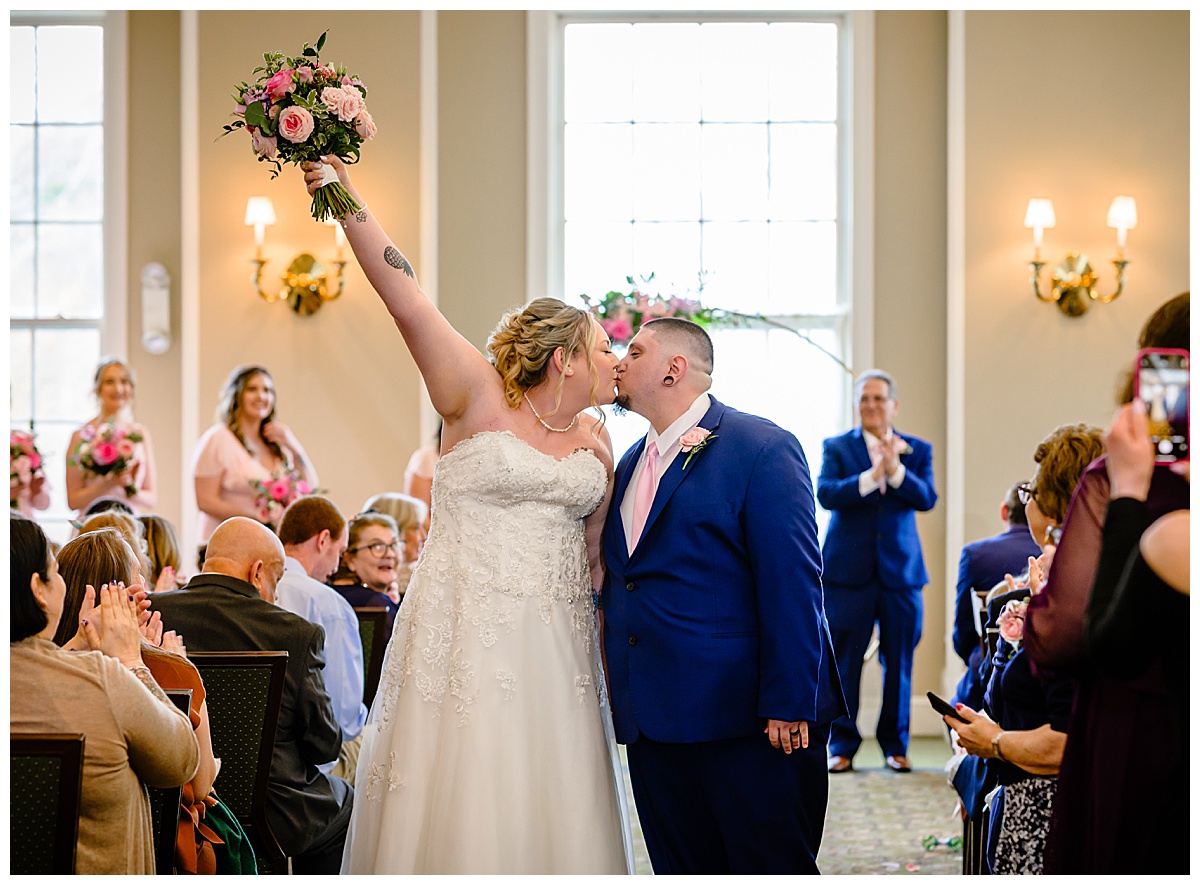 couple kissing at charter oak country club ceremony