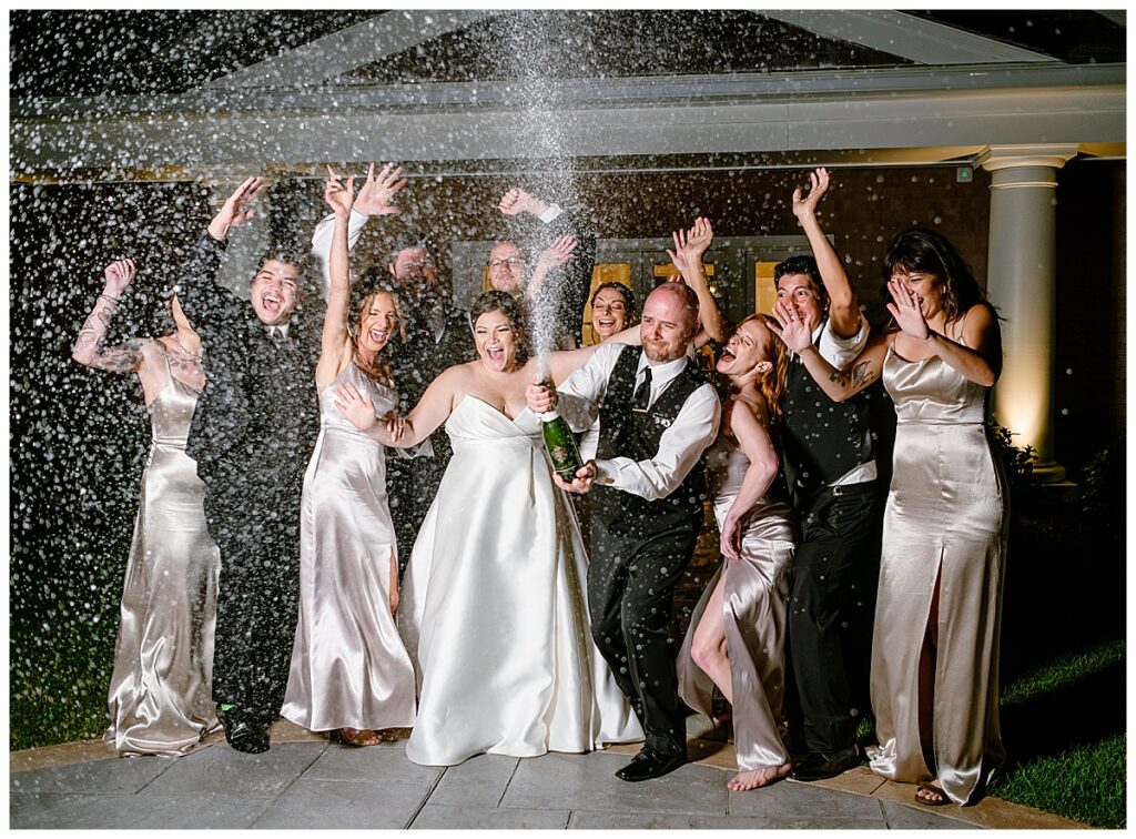 nighttime champagne pop at a Waverly Oaks Country Club wedding