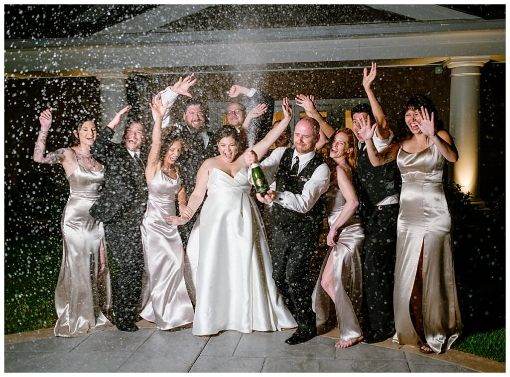 nighttime champagne pop at a Waverly Oaks Country Club wedding