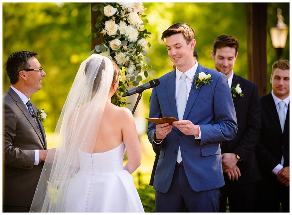 groom reading vows Atkinson country club ceremony