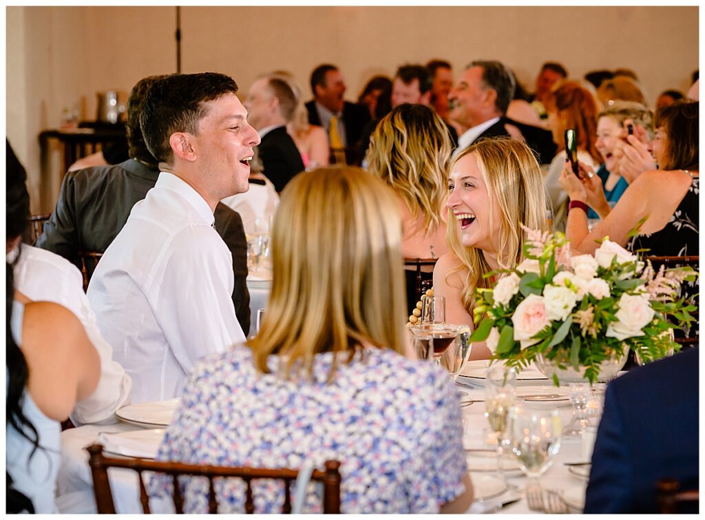 woman laughing at toast