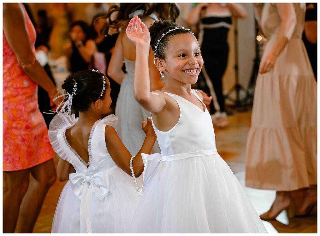 flower girls dancing at reception