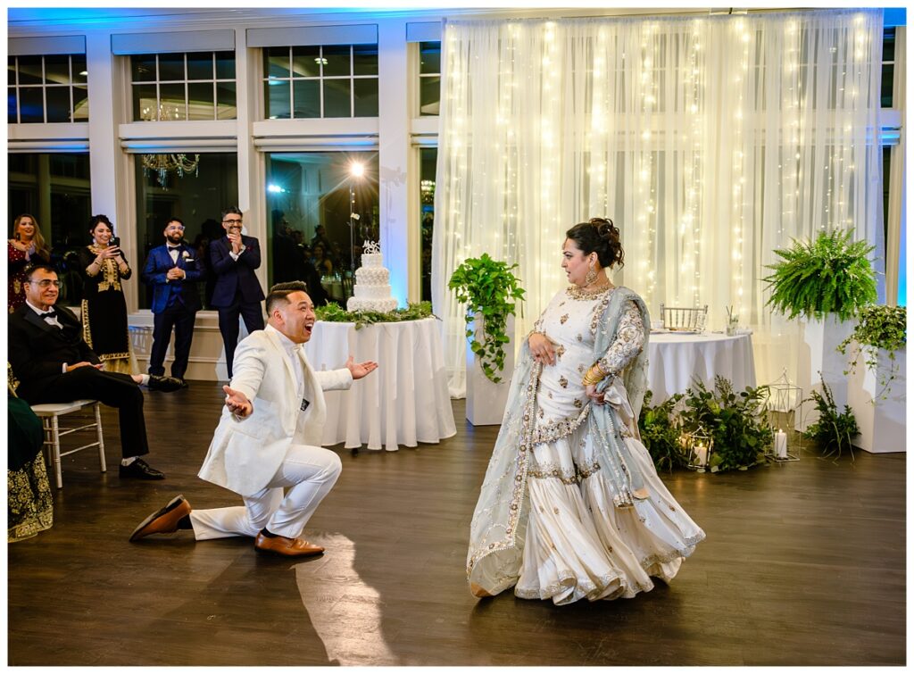 Couple wowing their guests with a fully choreographed first dance during their wedding reception at Four Oaks Country Club