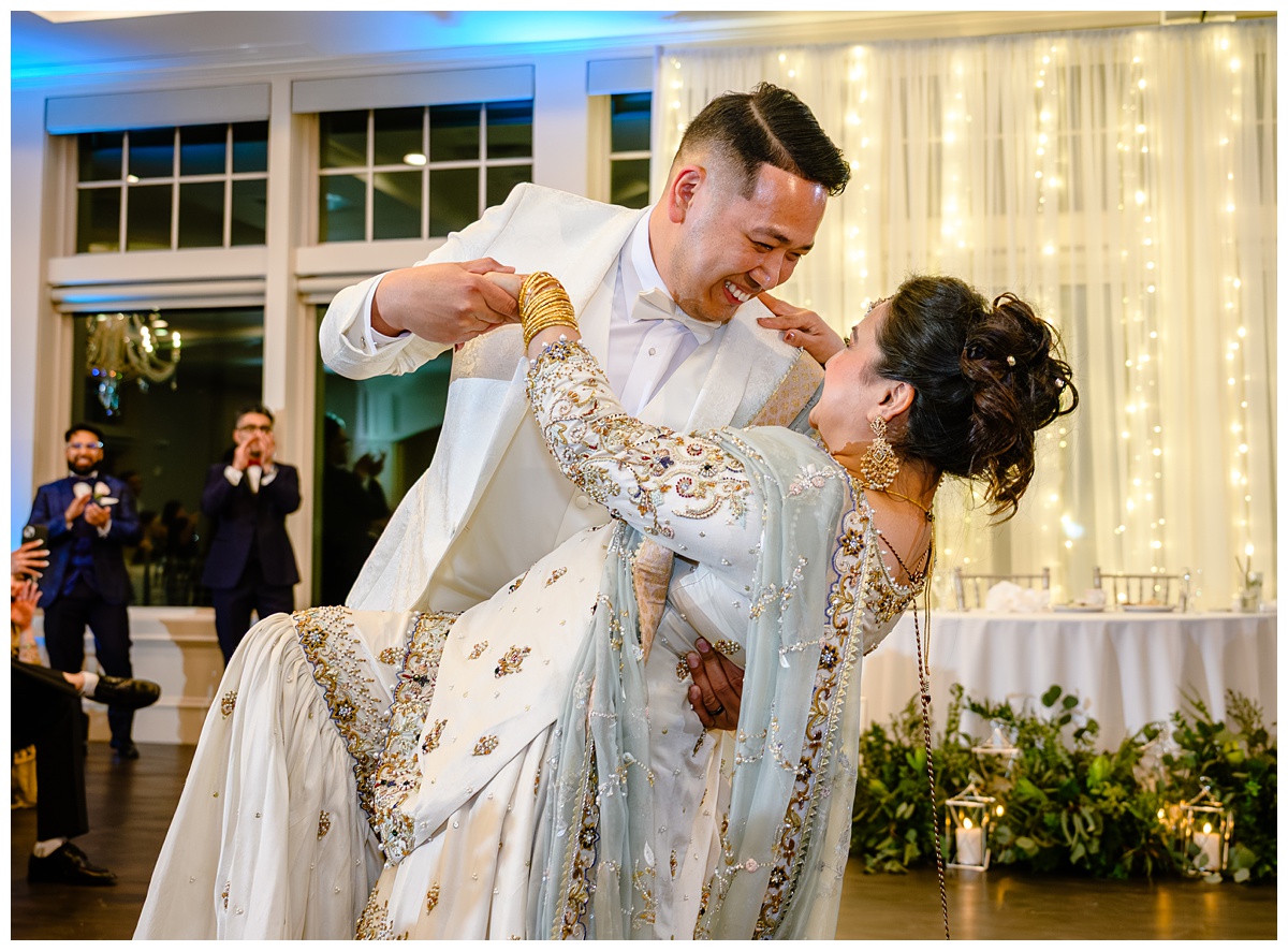 Couple wowing their guests with a fully choreographed first dance during their wedding reception at Four Oaks Country Club