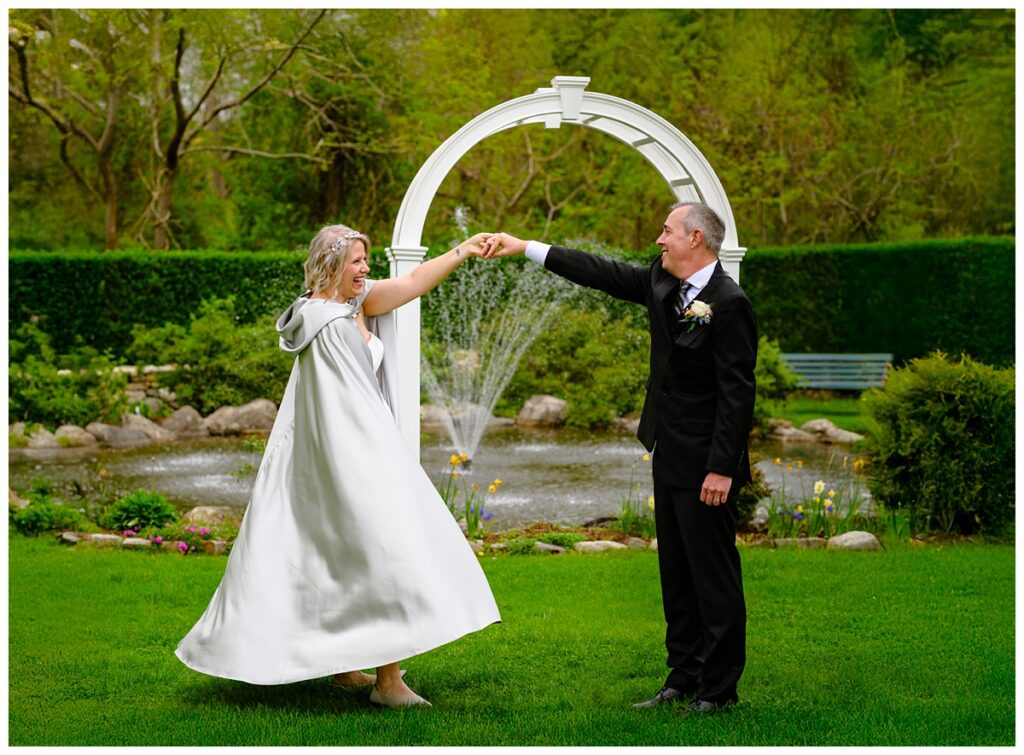 bride and groom dancing in the Sagamore Inn's gardens