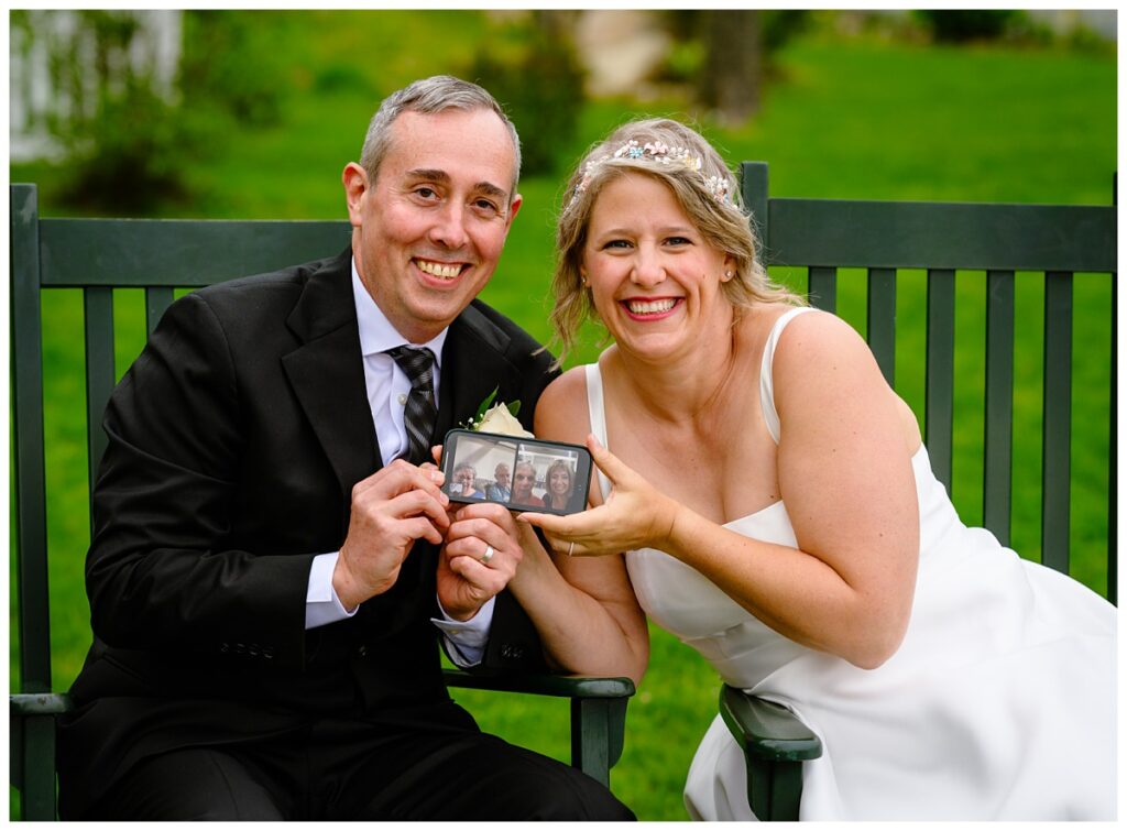bride and groom snuggling by the fire and FaceTiming their parents