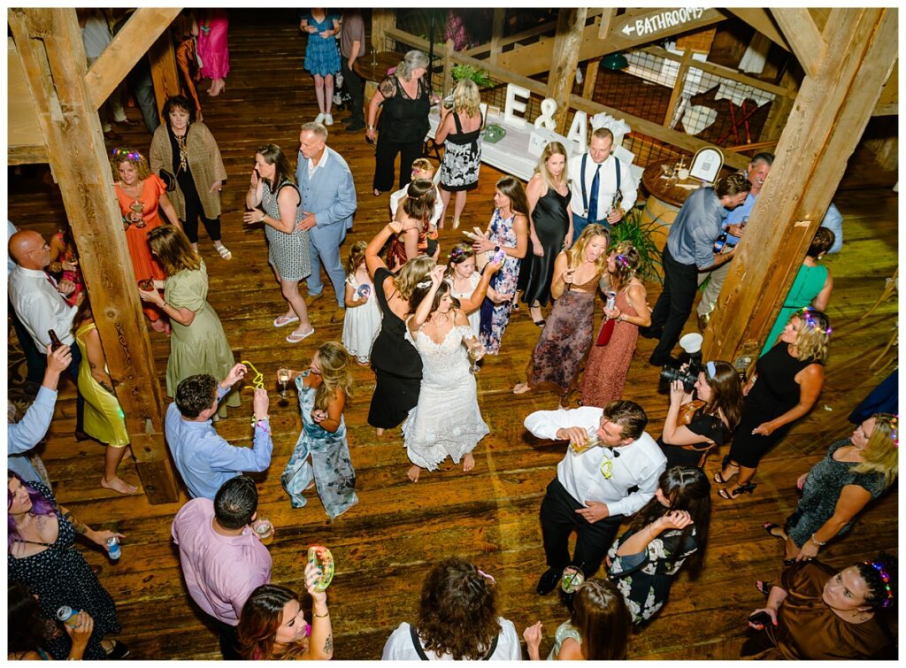looking down on packed dance floor at barn on the pemi wedding