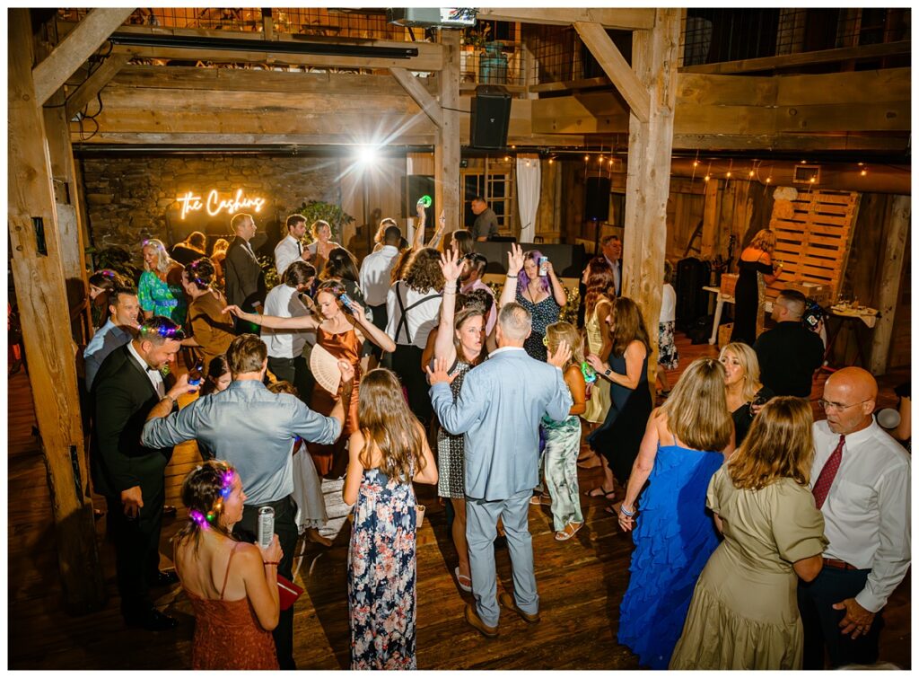 packed dance floor at barn on the pemi wedding