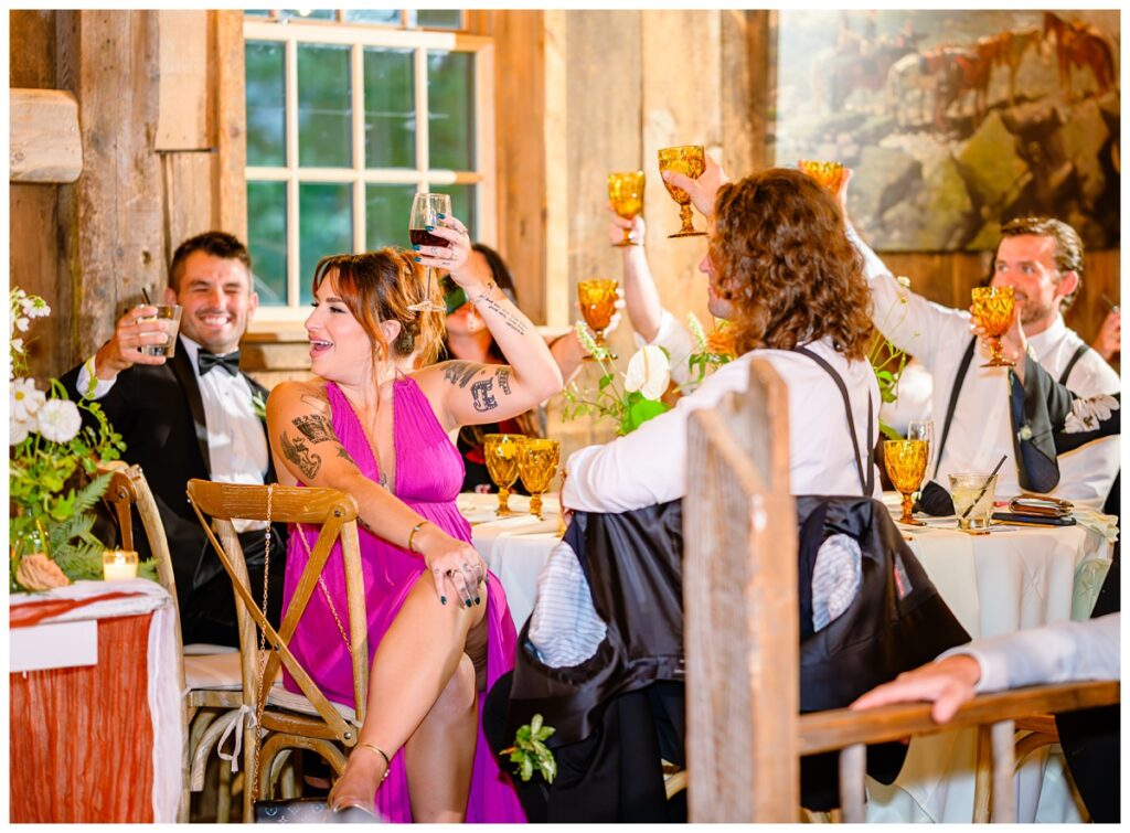 guests toast after speech at barn on the pemi wedding
