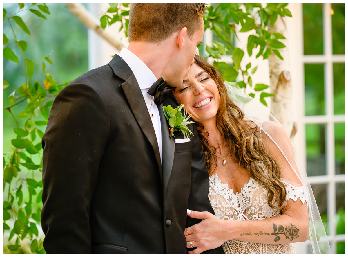 bride and groom snuggling at barn on the pemi wedding