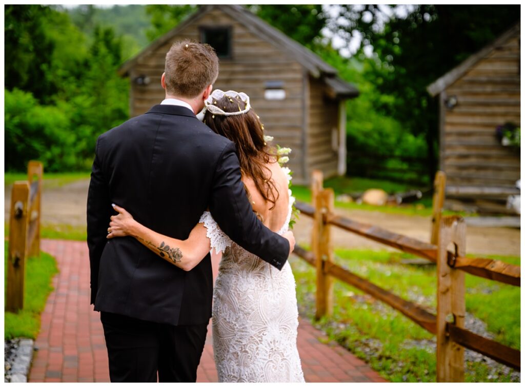 couple sharing a quiet moment after barn on the pemi wedding ceremony greenhouse
