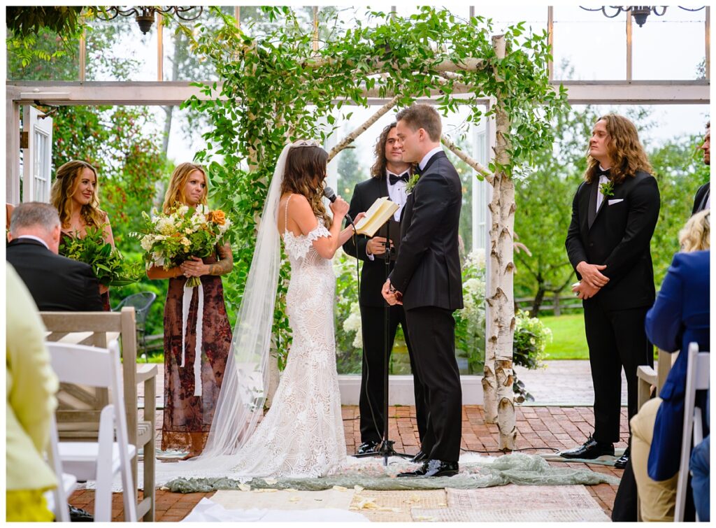 reading vows at barn on the pemi wedding ceremony greenhouse