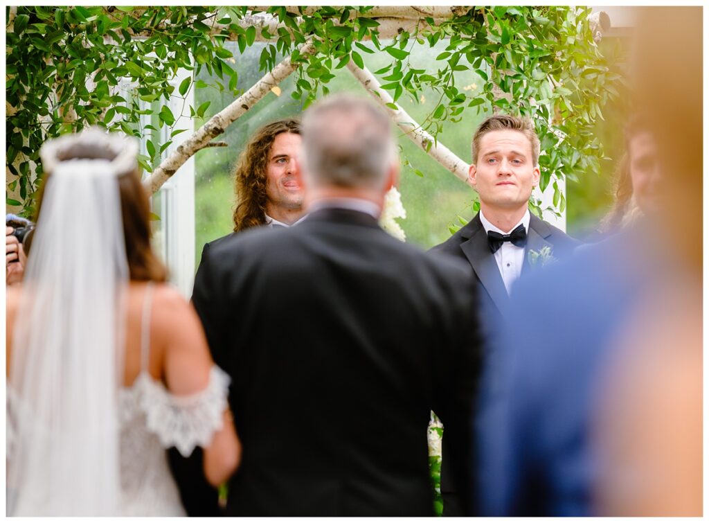 groom's reaction as bride walks down isle